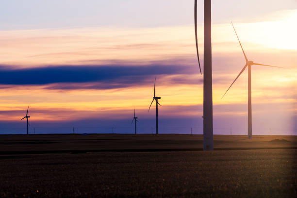 istock Wind turbines silhouette on sunset 1216498819