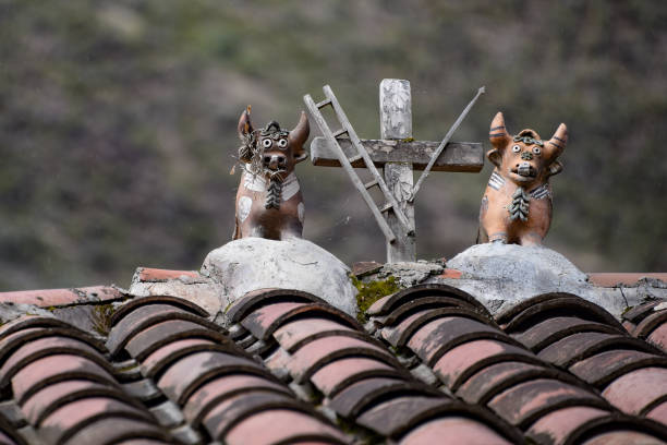 Traditional 'Toritos de Pucara' on a rooftop near Cusco, Peru. Pucara bulls are a tradition of Andean families to bring happiness, protection and prosperity to homes, and are an ancient art transmitted from generation to generation.