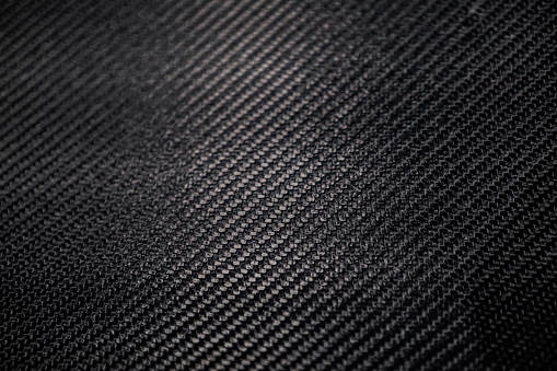 raw carbon fibre background.