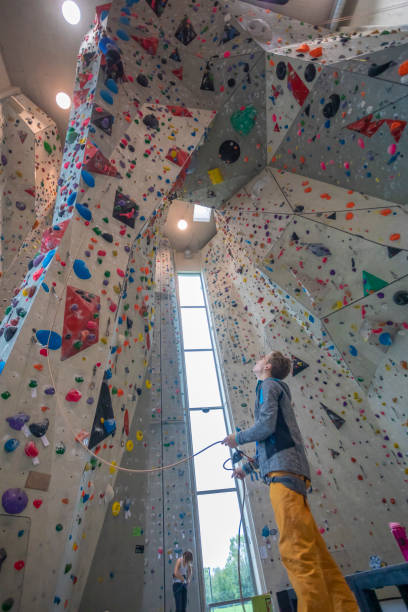 istock Young Woman Indoor Rock Climbing 1216503170