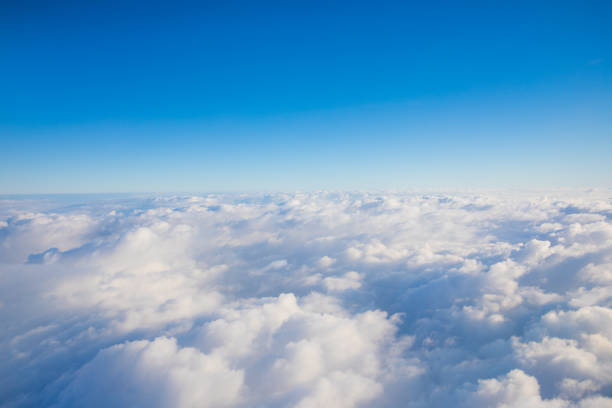 istock cloudscape shot from airplane, over the cloud, daytime 1216503344