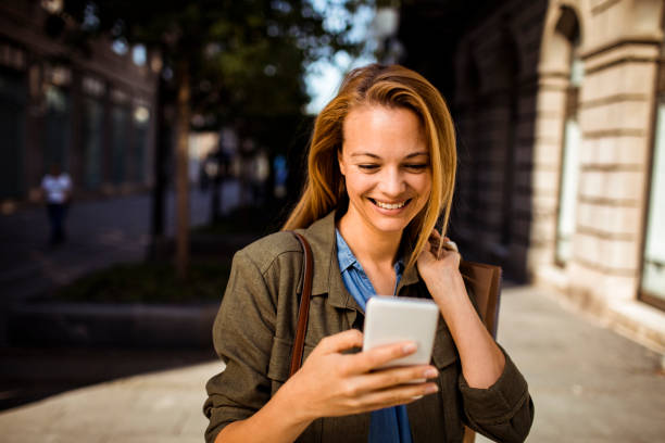 istock Young Lady shopping and using a Phone 1216503742