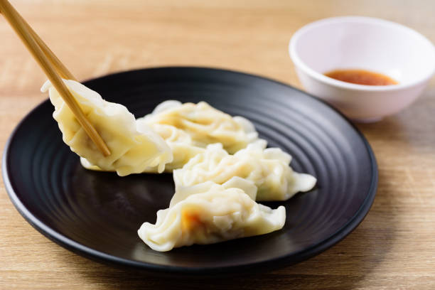 istock Steamed wonton dumpling stuffed with minced pork and shrimp 1216507405