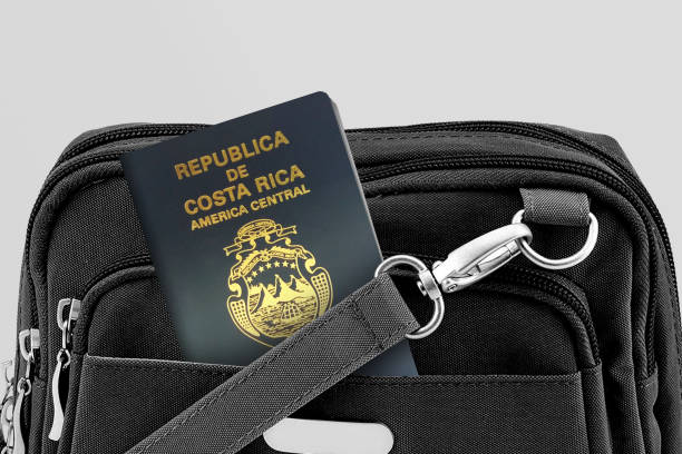 feche acima do passaporte da costa rica no bolso black travel bag - global business passport transportation italy - fotografias e filmes do acervo