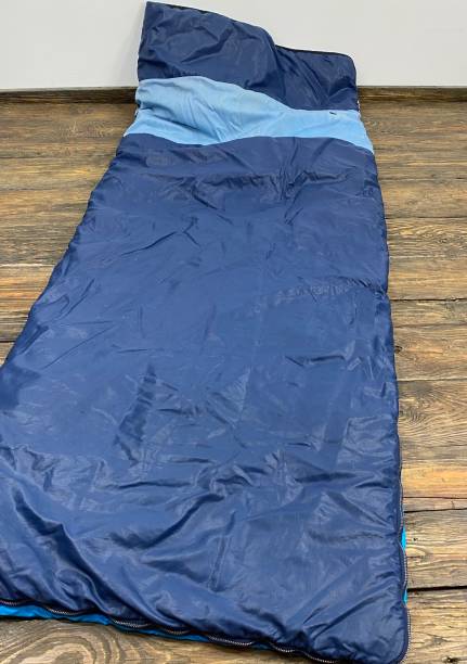 istock blue sleeping bag lies on the floor 1216516604