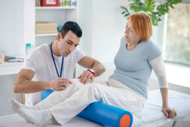 istock Pleasant senior woman having her legs treated 1216516922