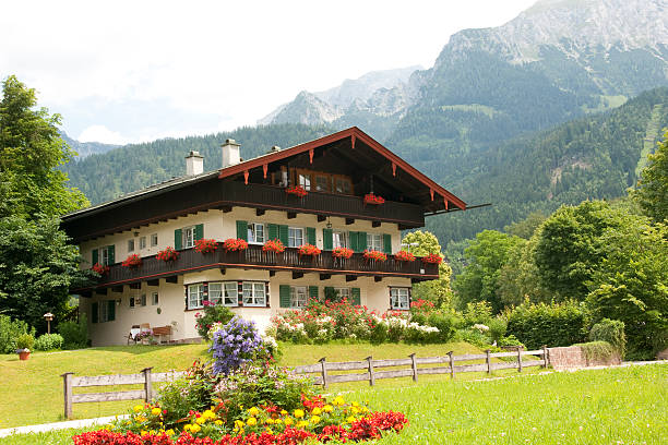 View of the small village of Höfle in the Kleinwalsertal region of the Austrian Alps with the mountains in the background