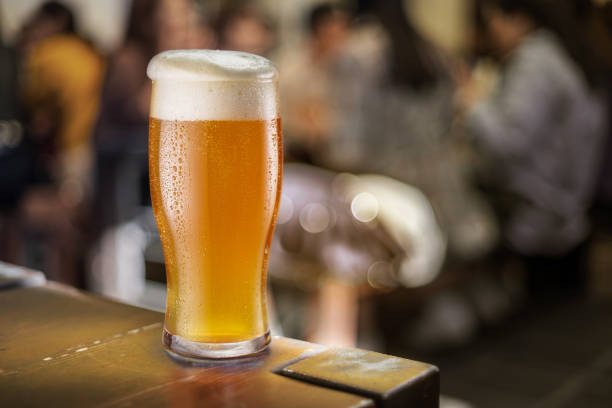istock Glass of beer stands on a table in a pub. Light beer. 1216518751