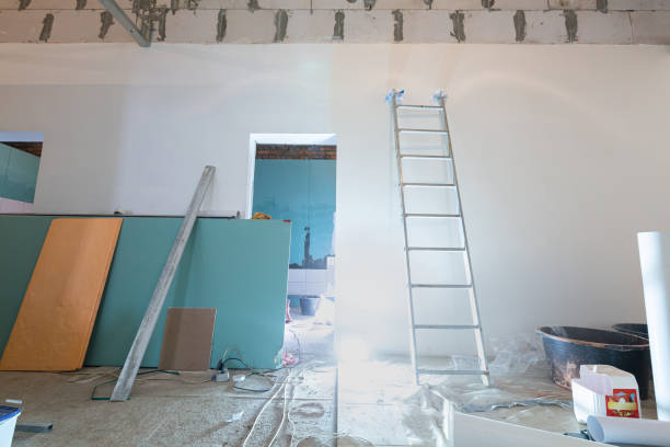 istock Working process of installing plasterboard or drywall for making gypsum walls in apartment is under construction, remodeling, renovation, extension, restoration and reconstruction. Concept of home improvement or renovate. 1216520986