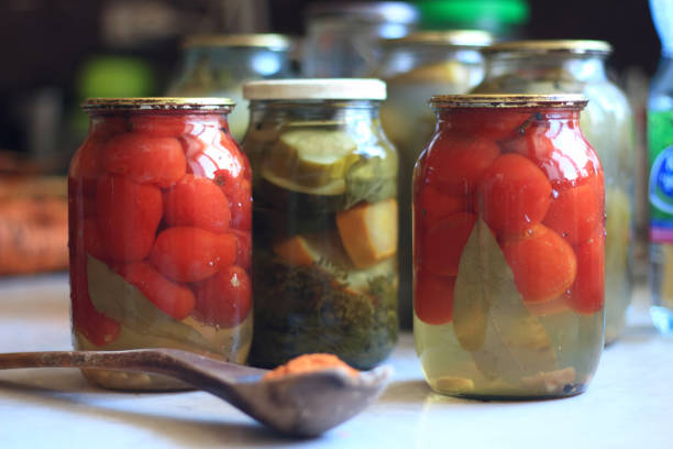 istock jars of pickles tomatoes and cucumbers 1216523530