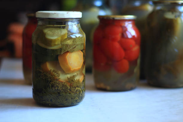 istock jars of pickles tomatoes and cucumbers 1216523553