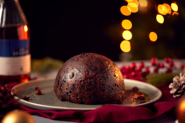 istock Brandy Soaked Christmas Pudding On Table Set For Festive Christmas Meal 1216523906