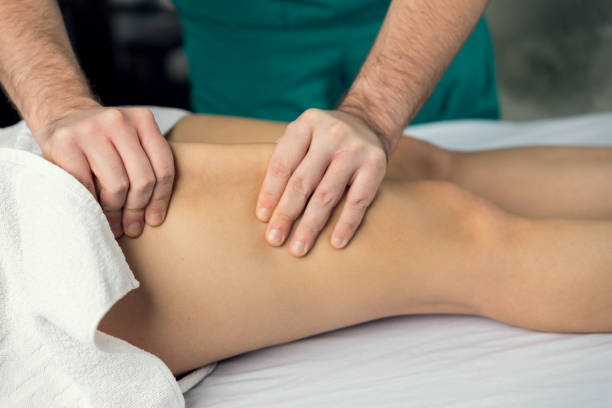 istock Male hands does Lymphatic drainage massage of the hips. 1216525091