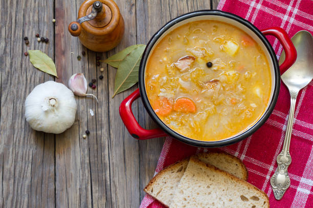 Cabbage polish soup on old boards food concept