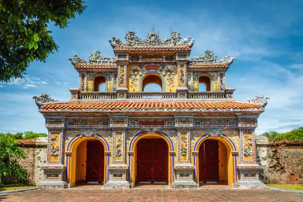 Hien Nhon Gate in Hue, the former imperial capital of Vietnam, at the Imperial Citadel. Eastern Entrance - Main Gate - of the of the Imperial Palace, forbidden Purple City and Citadel under blue summer sky. Hue, Vietnam, East Asia, Asia.