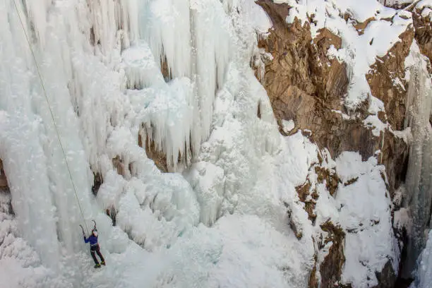 Ice climber with ice axes at the 2020 Ouray Ice Climbing Festival in Ouray, Colorado