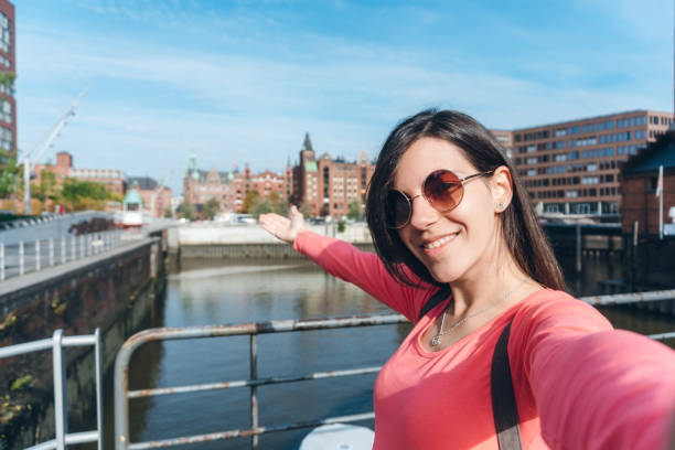 istock Tourist making selfies / vlogging in Hafen City 1216525793
