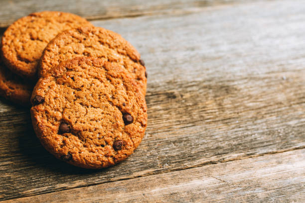 istock Fresh and healthy cookies with chocolate and seeds on the rustic background 1216525886