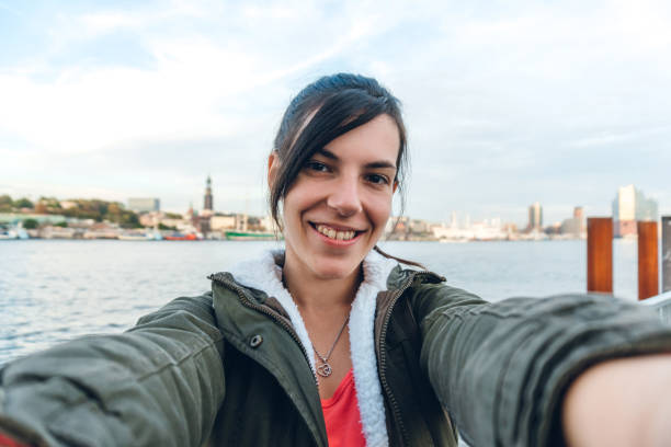 istock Tourist making selfies / vlogging in Hafen City 1216525887