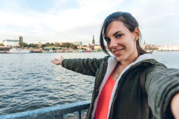 istock Tourist making selfies / vlogging in Hafen City 1216525920