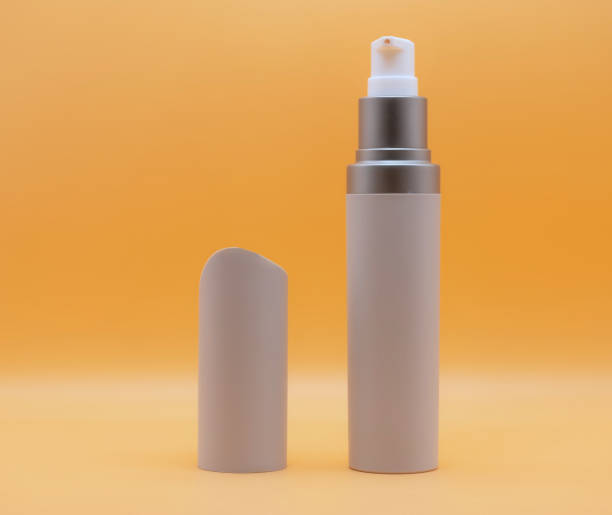 istock Luxurious sunscreen jar Removable cover on orange background, isolated 1216527494