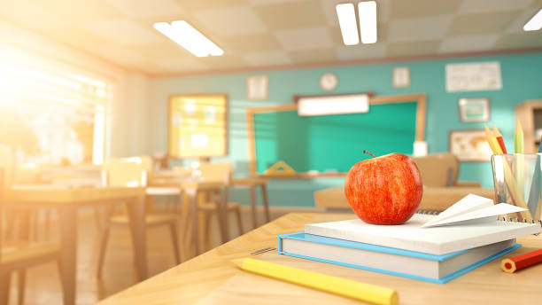 istock Cartoon style school elements - book, pen, pencils and red apple on desk in empty classroom. 3D rendering illustration. Back to school design template without people. 1216527546