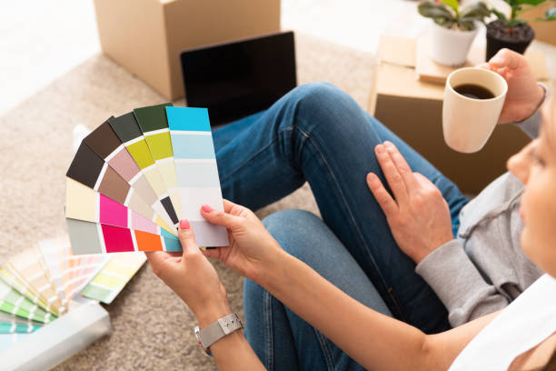 istock Couple take a break with coffee choose color for walls 1216528450