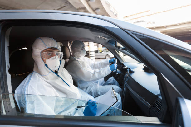 istock Man in protective suits counting how many people on streets 1216529824