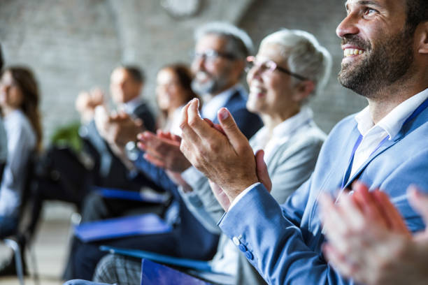 istock Happy entrepreneurs applauding on education event in board room. 1216530000