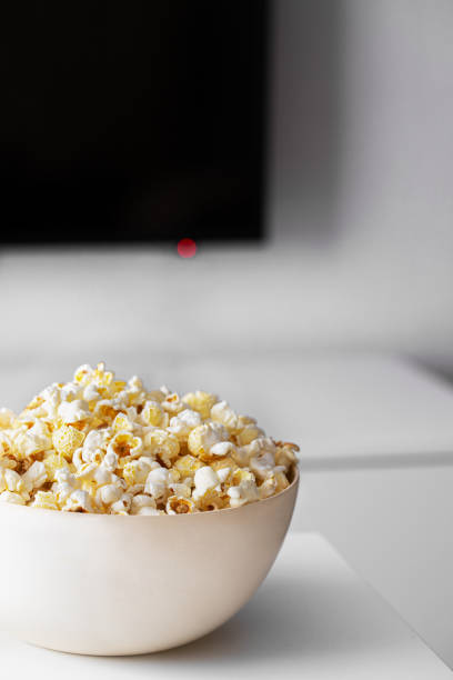istock Popcorn bowl  and lcd screen for watching Tv at home concept. 1216530837