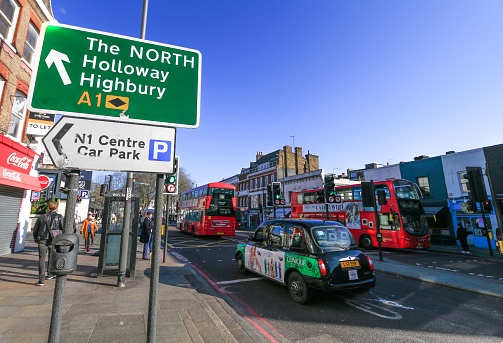The Angel in Islington, London with signs showing directions towards boroughs and car parks