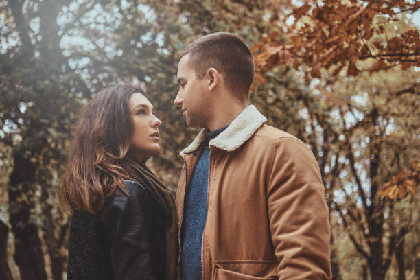 istock Couple has romantic date at autumn park 1216531355