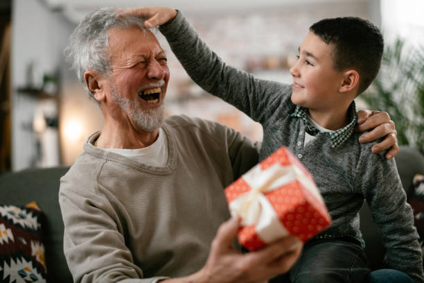 istock Grandpa giving his grandson present. 1216532241