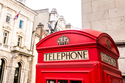 Red phone booth in London. United Kingdom. UK. Europe.