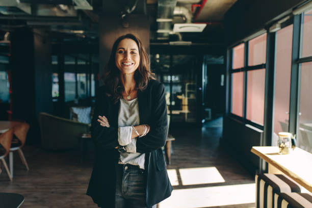 istock Successful businesswoman standing in office 1216535536