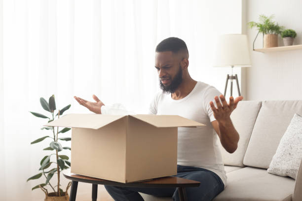istock Surprised african american millennial man spreads his hands 1216535939