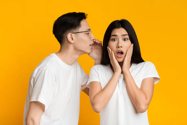 istock Young asian guy telling exciting news to his lover 1216536298