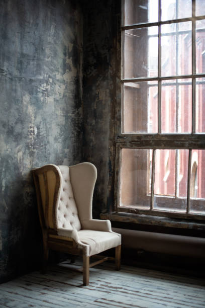 istock Empty old-fashioned armchair near the window 1216536440
