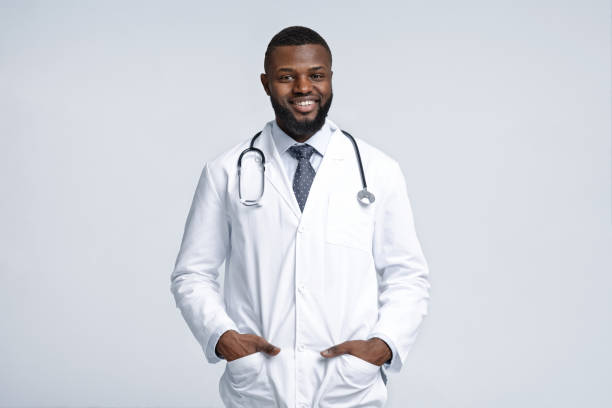 istock Friendly african male therapist posing over white background 1216536570