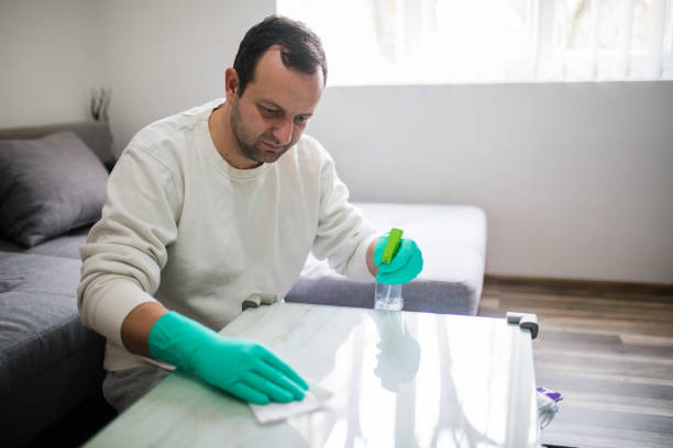 istock Deep cleaning for Covid-19 disease Alcohol, disinfectant spray on table. 1216536815