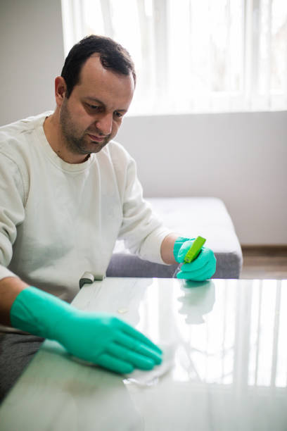 istock Deep cleaning for Covid-19 disease Alcohol, disinfectant spray on table. 1216537693