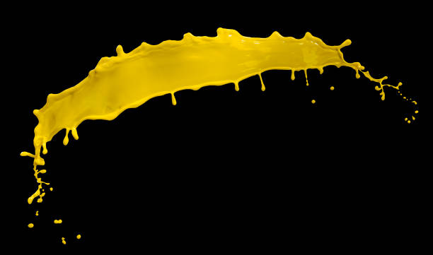 istock splendid yellow paint splash isolated on black background 1216537720