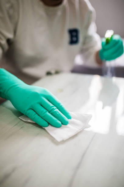 istock Deep cleaning for Covid-19 disease Alcohol, disinfectant spray on table. 1216537961