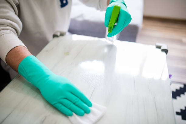 istock Deep cleaning for Covid-19 disease Alcohol, disinfectant spray on table. 1216538063