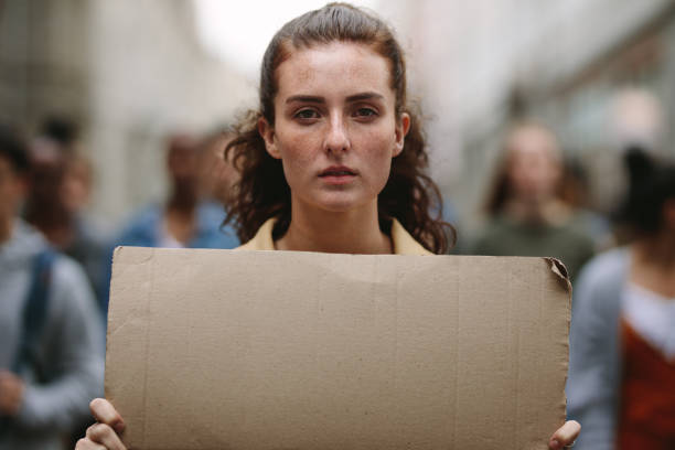 istock Female activist leading a protest 1216538344