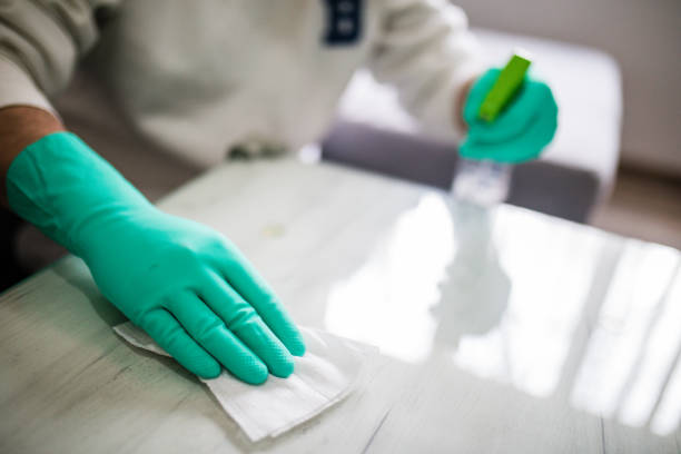istock Deep cleaning for Covid-19 disease Alcohol, disinfectant spray on table. 1216538404