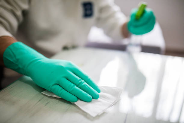 istock Deep cleaning for Covid-19 disease Alcohol, disinfectant spray on table. 1216538541