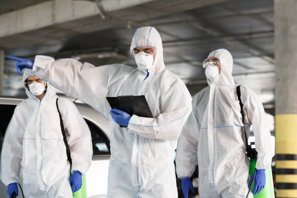 istock Men in virus protective suits enclosing the quarantine zone 1216538593