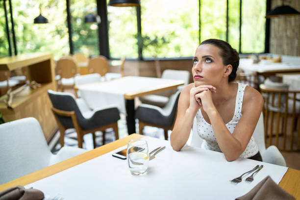 istock Beautiful woman in restaurant 1216538672