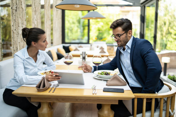 istock Business people dining in restaurant and talking 1216538735